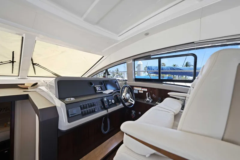 Slide: The Image of Interior helm of 2017 Sea Ray Sundancer 400 yacht with modern controls and seating. - 11