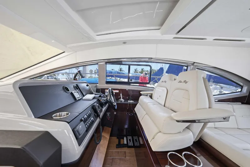 Slide: The Image of Interior of 2017 Sea Ray Sundancer 400 yacht with luxurious seating and modern dashboard. - 16