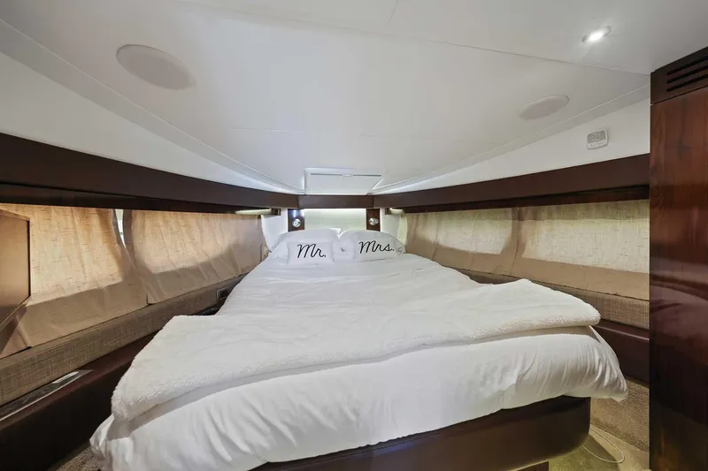 Slide: The Image of Luxurious 2017 Sea Ray Sundancer 400 cabin with cozy bedding and elegant wood finishes. - 20
