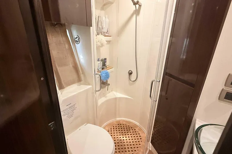 Slide: The Image of Bathroom interior of 2017 Sea Ray Sundancer 400 yacht, featuring shower and toilet. - 21