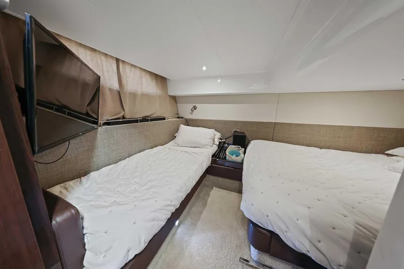 Slide: The Image of 2017 Sea Ray Sundancer 400 cabin with twin beds and modern interior design. - 22