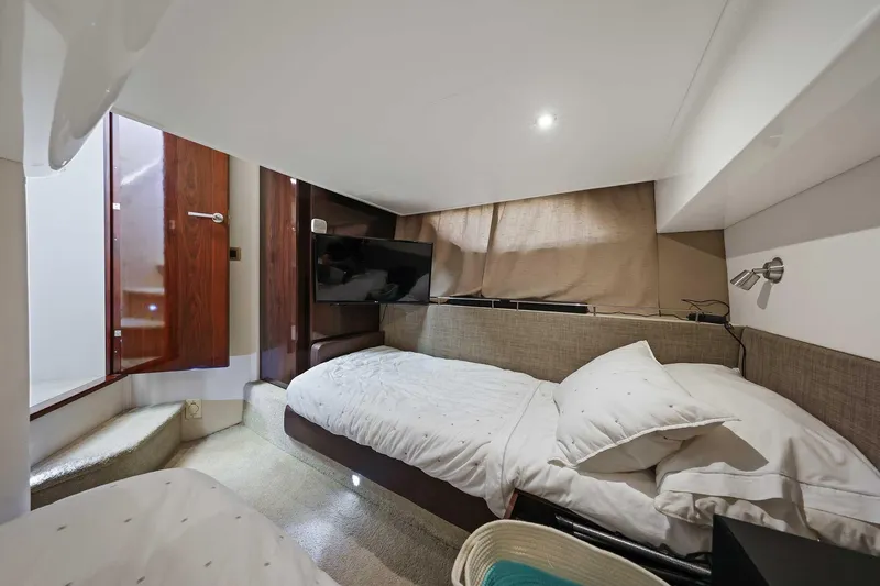 Slide: The Image of Cozy cabin interior of 2017 Sea Ray Sundancer 400 yacht with twin beds and TV. - 24