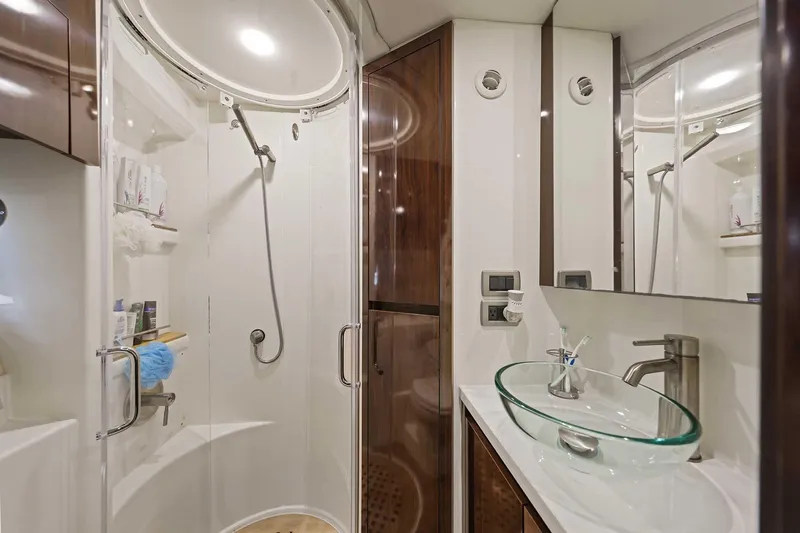 Slide: The Image of Luxurious bathroom in 2017 Sea Ray Sundancer 400 yacht with glass sink and shower. - 27
