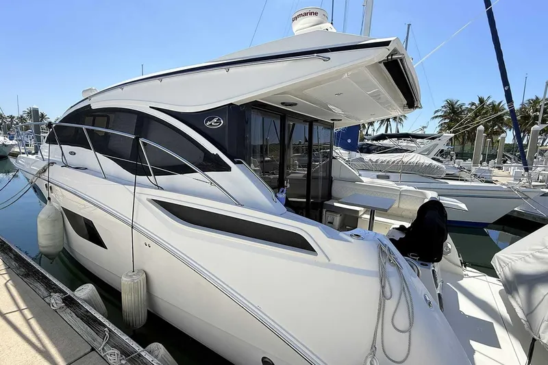 Slide: The Image of 2017 Sea Ray Sundancer 400 yacht docked at marina, featuring sleek design and modern amenities. - 29