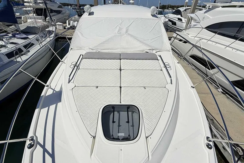Slide: The Image of 2017 Sea Ray Sundancer 400 yacht with sunpad, docked at marina. - 31
