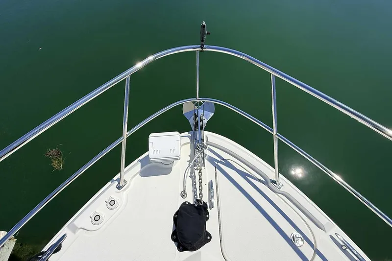 Slide: The Image of Bow view of 2017 Sea Ray Sundancer 400 yacht on calm water. - 34