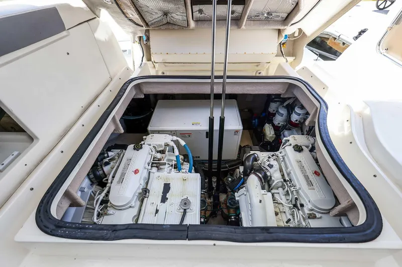 Slide: The Image of Engine compartment of 2017 Sea Ray Sundancer 400 yacht, showcasing dual engines and mechanical components. - 36