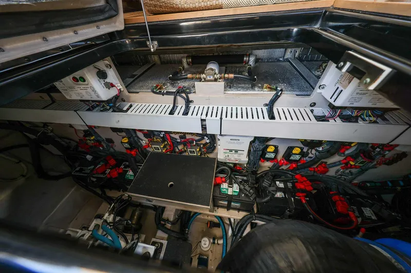 Slide: The Image of Engine room of a 2017 Sea Ray Sundancer 400, showcasing electrical systems and components. - 38