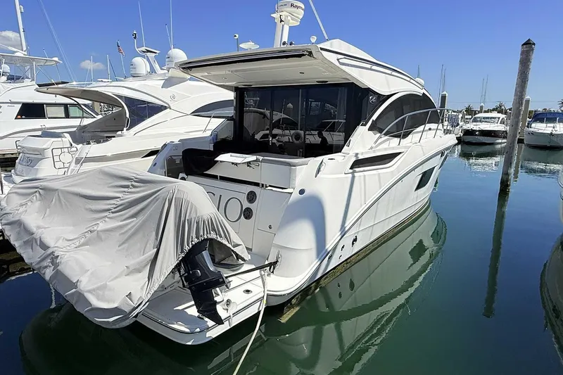 Slide: The Image of 2017 Sea Ray Sundancer 400 yacht docked at marina, rear view. - 7