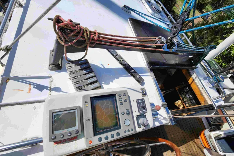 Slide: The Image of Cockpit of 2000 Custom Bruce Roberts sailboat with navigation equipment and rigging. - 18