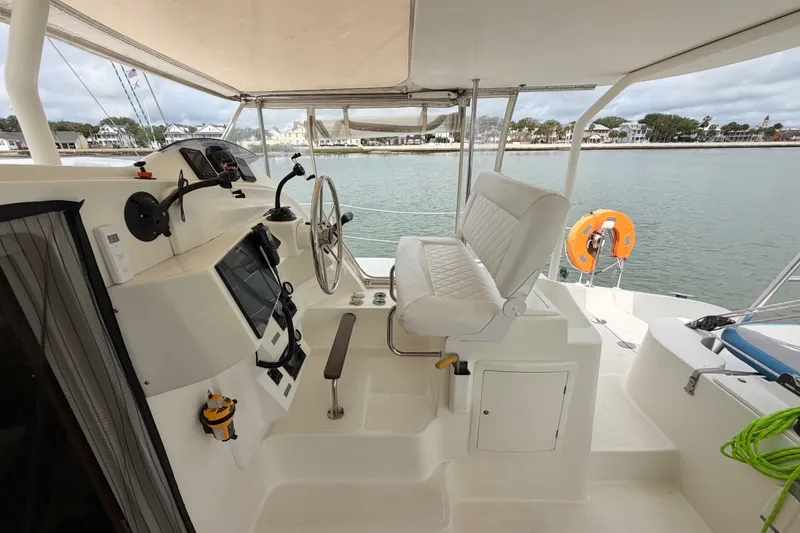 Slide: The Image of Helm of 2007 Dolphin 460 yacht with steering wheel and navigation equipment. - 21