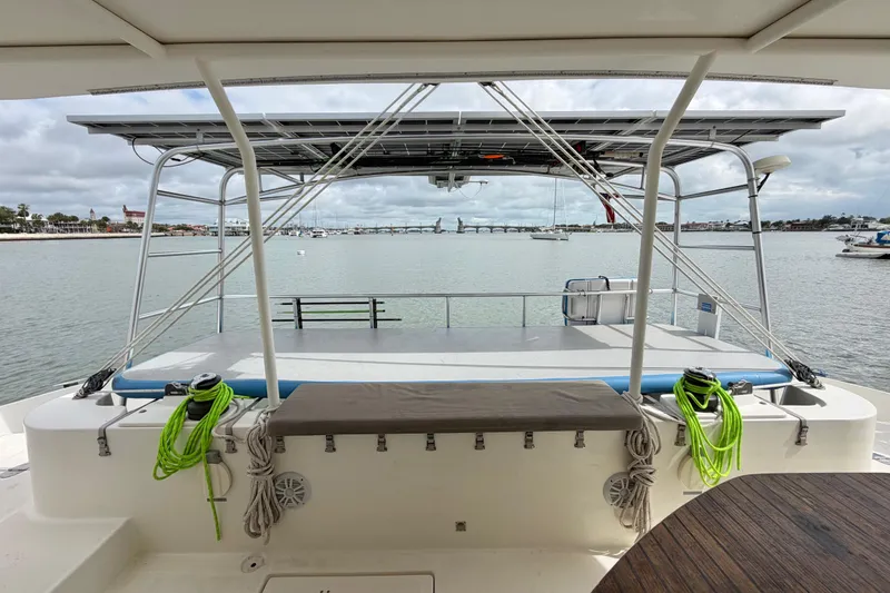 Slide: The Image of View from Dolphin 460 yacht, 2007 model, overlooking calm waters and distant shoreline. - 22