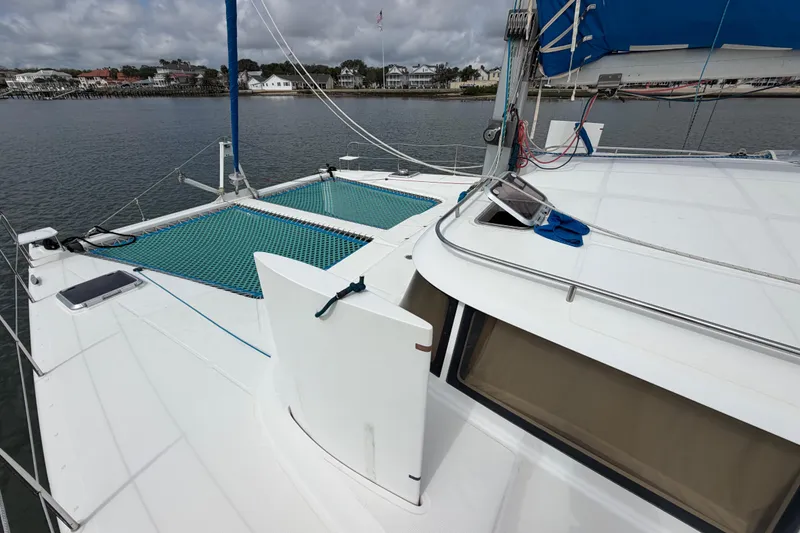 Slide: The Image of Sailing catamaran Dolphin 460, 2007 model, docked with visible netting and deck details. - 30