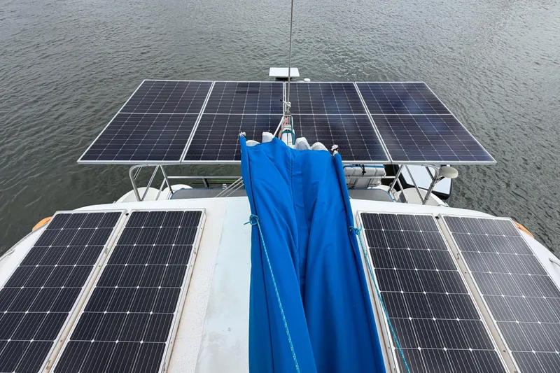 Slide: The Image of Solar panels on a 2007 Dolphin 460 boat, harnessing renewable energy on water. - 39