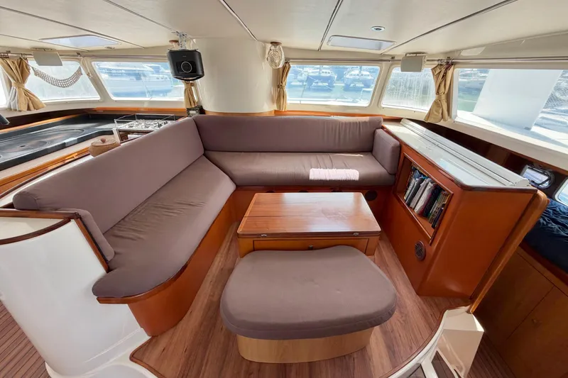 Slide: The Image of Luxurious 2007 Dolphin 460 yacht interior with cozy seating and elegant wood finishes. - 45