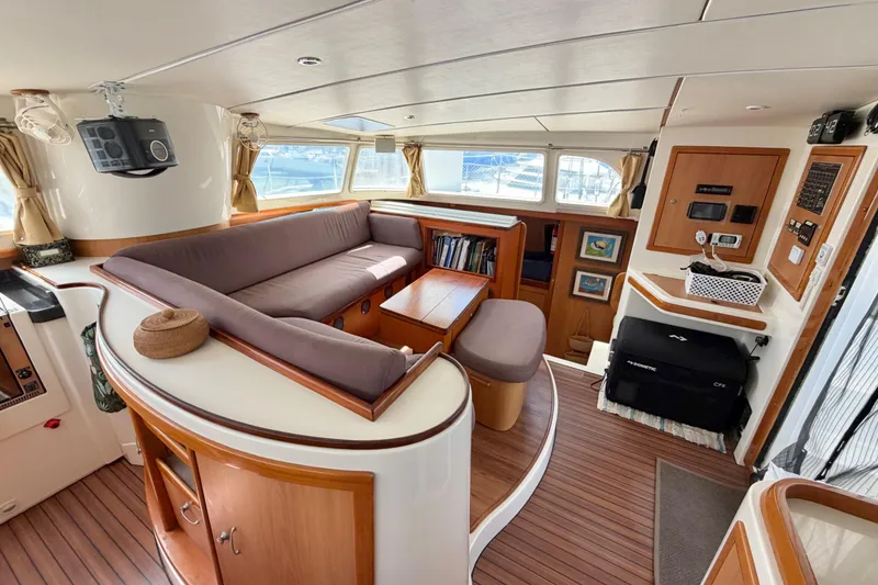 Slide: The Image of Luxurious interior of a 2007 Dolphin 460 yacht with elegant wood finishes and cozy seating. - 46