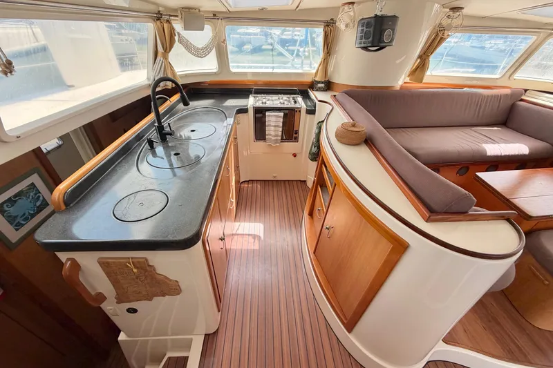 Slide: The Image of Luxurious 2007 Dolphin 460 yacht interior with modern kitchen and cozy seating area. - 47