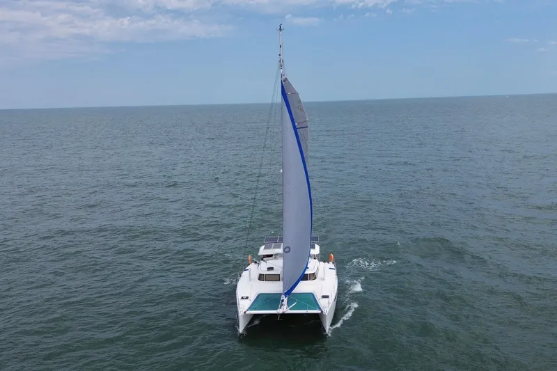 Slide: The Image of Sailing catamaran Dolphin 460, 2007 model, cruising on open sea under clear skies. - 5