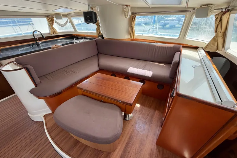 Slide: The Image of Luxurious interior of 2007 Dolphin 460 yacht with cozy seating and elegant wood finishes. - 51