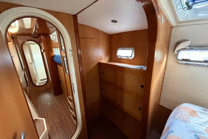 Slide: The Image of Interior of 2007 Dolphin 460 yacht with wooden finish and cozy cabin space. - 59