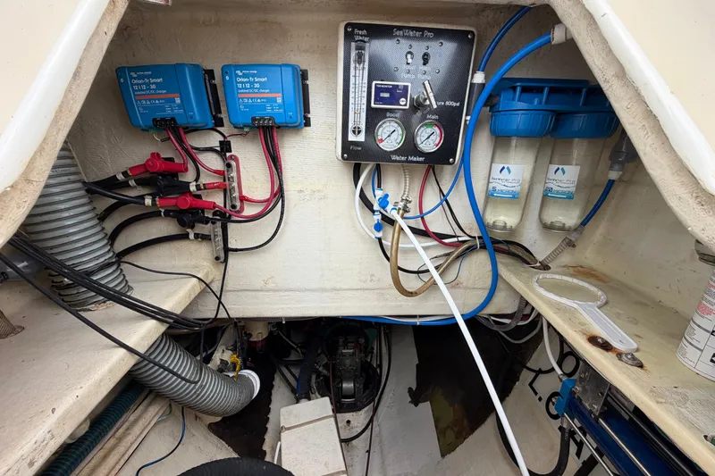 Slide: The Image of Electrical and water filtration system inside a 2007 Dolphin 460 boat. - 86