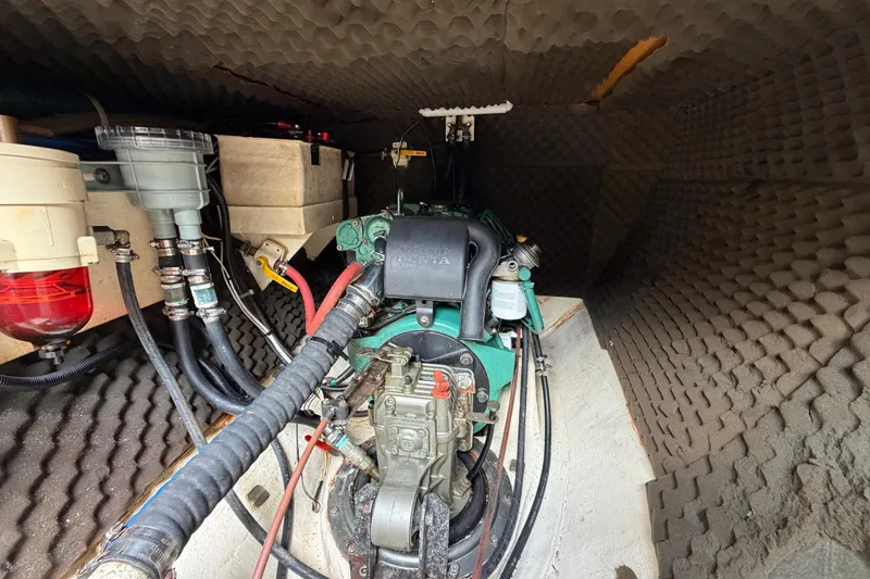 Slide: The Image of Engine compartment of a 2007 Dolphin 460 with soundproofing and visible wiring. - 88
