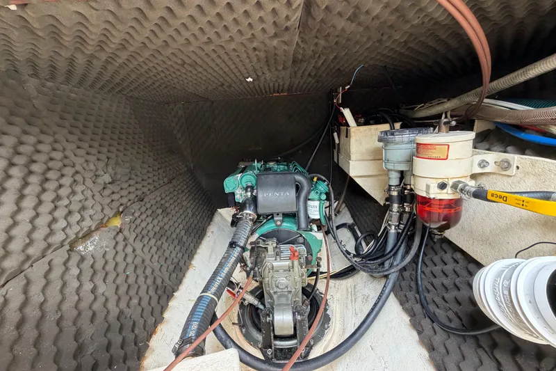Slide: The Image of Engine compartment of a 2007 Dolphin 460 boat with visible machinery and wiring. - 90
