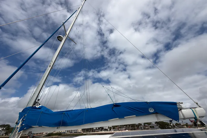 Slide: The Image of Sailboat mast and rigging against cloudy sky, Dolphin 460 model, 2007. - 91