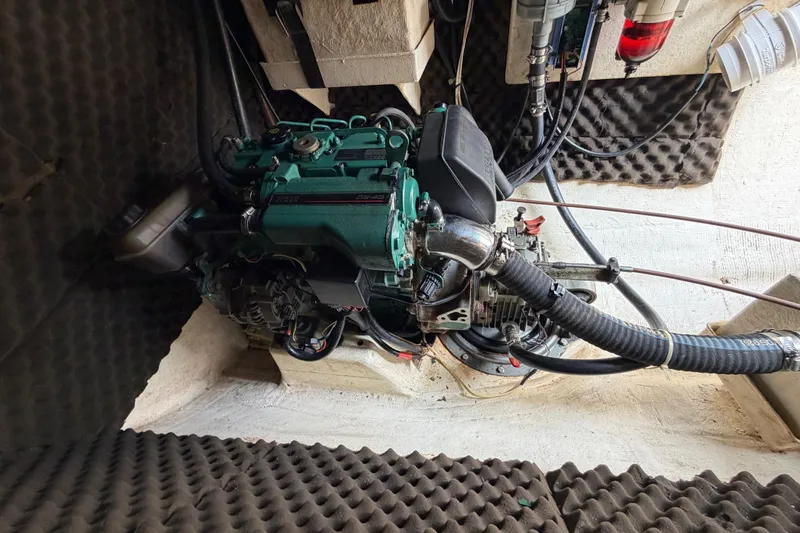 Slide: The Image of Engine compartment of a 2007 Dolphin 460 with visible hoses and components. - 92