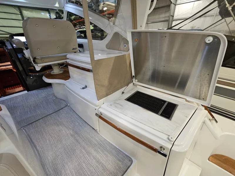 Slide: The Image of Interior of a 2014 Tiara Yachts 43 Open with seating area. - 12
