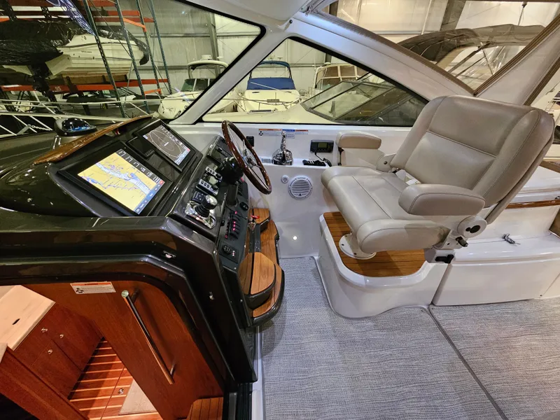 Slide: The Image of Interior of 2014 Tiara Yachts 43 Open with helm station. - 15