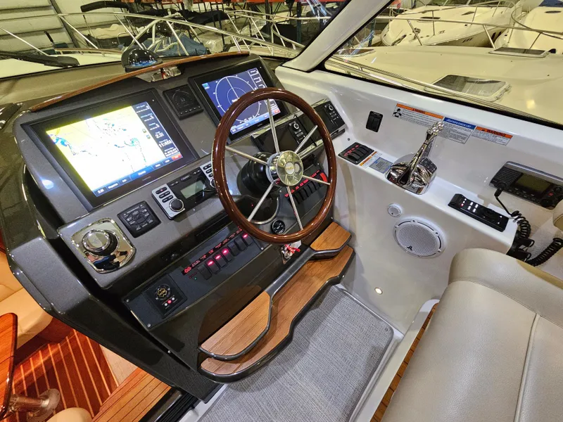 Slide: The Image of 2014 Tiara Yachts 43 Open cockpit with modern navigation systems. - 2