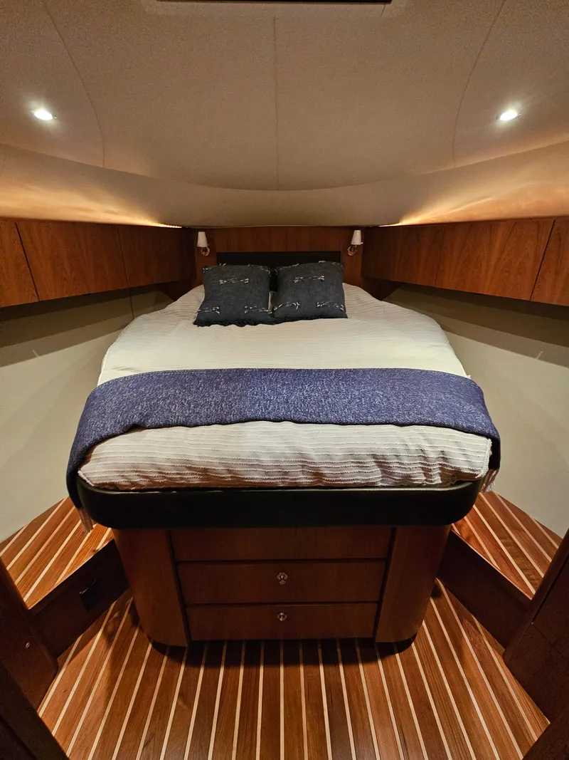 Slide: The Image of Luxurious bedroom in a 2014 Tiara Yachts 43 Open yacht. - 4