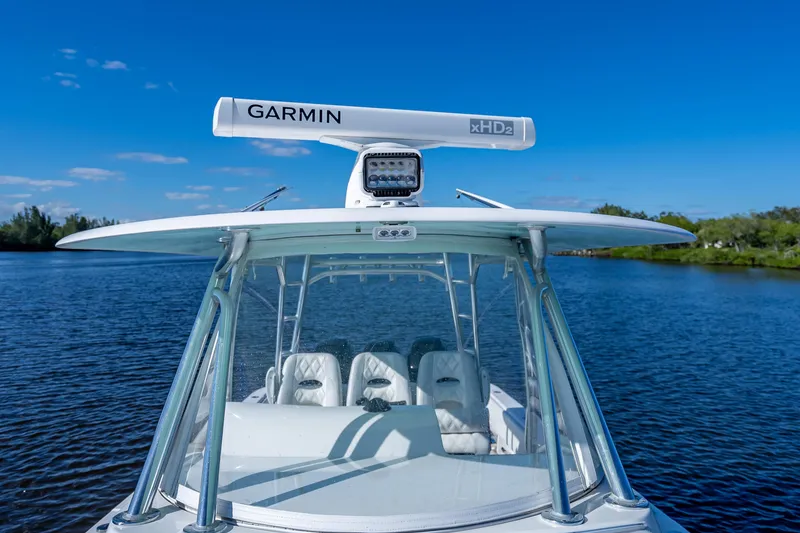 Slide: The Image of 2019 Contender 39 Fisharound boat with Garmin radar on calm water. - 19