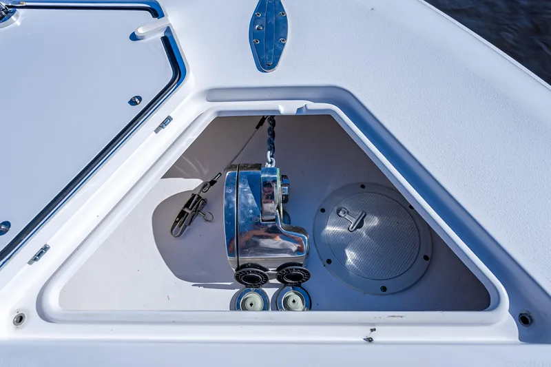 Slide: The Image of 2019 Contender 39 Fisharound anchor locker with winch and storage compartment. - 32