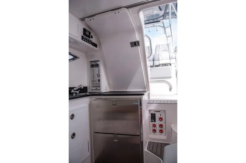 Slide: The Image of Manufacturer Provided Image: 2019 Contender 39 Fisharound interior cabin with stainless steel appliances. - 34