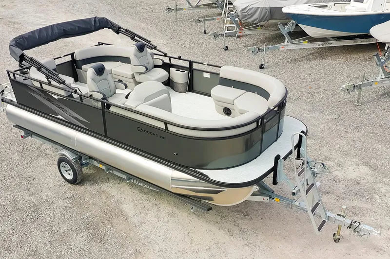 The Image of 2026 Dockside 20DQ pontoon boat on trailer, featuring sleek design and comfortable seating. - 1