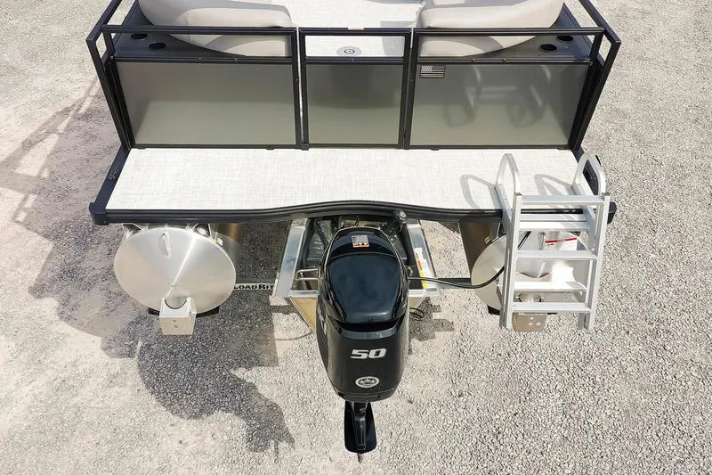Slide: The Image of 2026 Dockside 20DQ pontoon boat with outboard motor and ladder, viewed from above. - 11