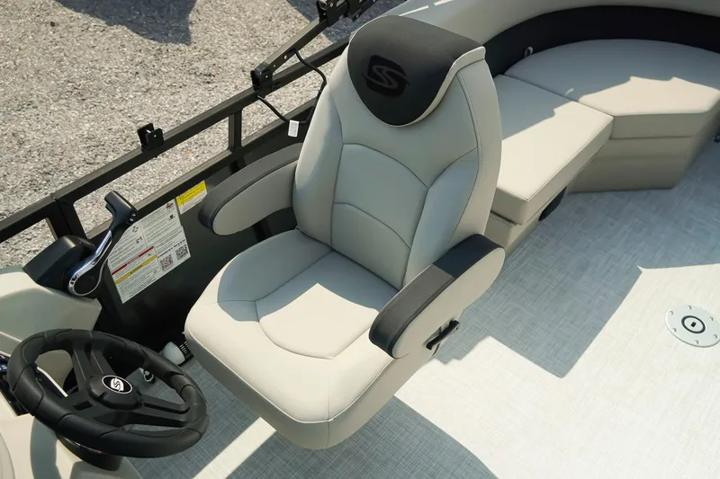 Slide: The Image of Captain's chair and helm of 2026 Dockside 20DQ boat, featuring modern design and controls. - 14