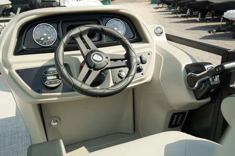 Slide: The Image of Steering console of 2026 Dockside 20DQ boat with modern controls and gauges. - 15