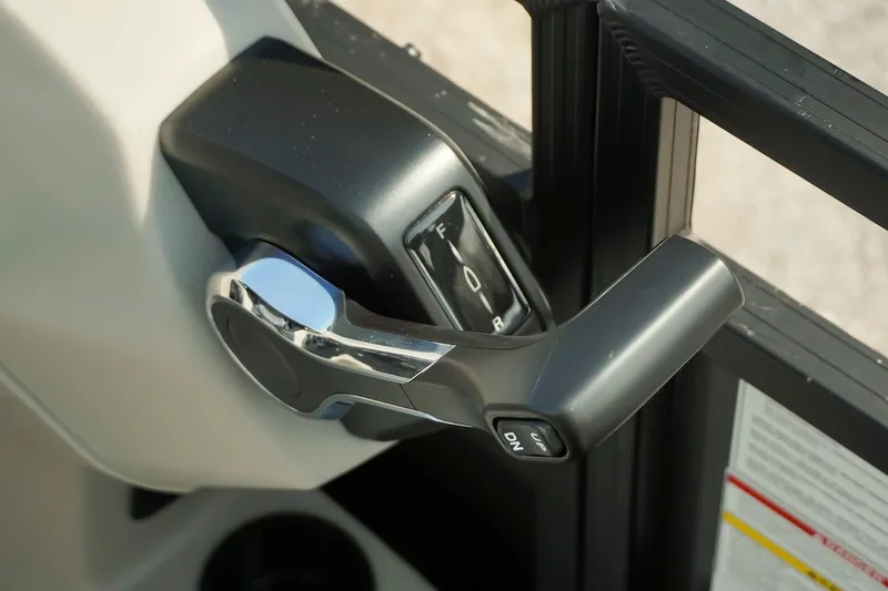 Slide: The Image of Close-up of Dockside 20DQ 2026 boat throttle control lever. - 21