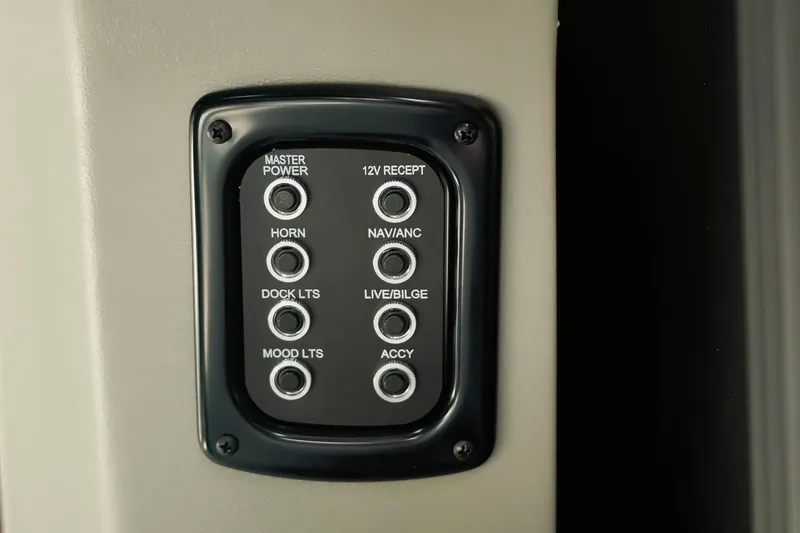 Slide: The Image of Control panel on Dockside 20DQ 2026 boat with labeled switches for various functions. - 22
