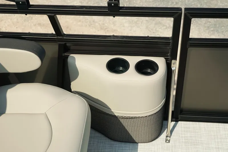 Slide: The Image of Cup holders and seating on a 2026 Dockside 20DQ boat interior. - 26