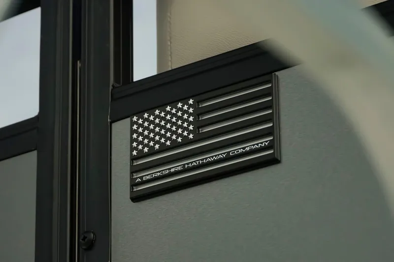 Slide: The Image of Plaque on Dockside 20DQ 2026 model, featuring American flag and Berkshire Hathaway branding. - 39