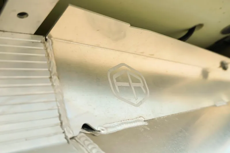 Slide: The Image of Close-up of Dockside 20DQ 2026 model's metallic surface with logo detail. - 40