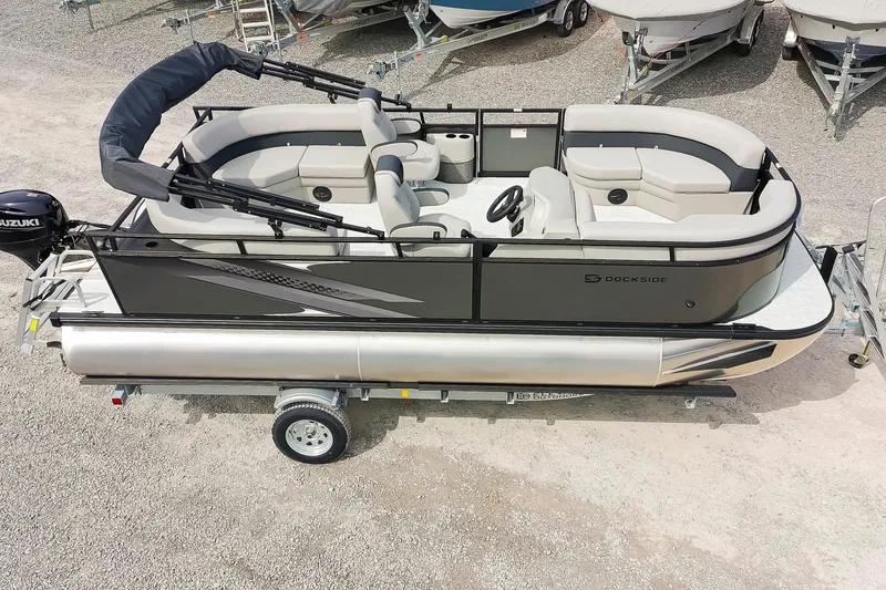 Slide: The Image of 2026 Dockside 20DQ pontoon boat on trailer, featuring sleek design and comfortable seating. - 5