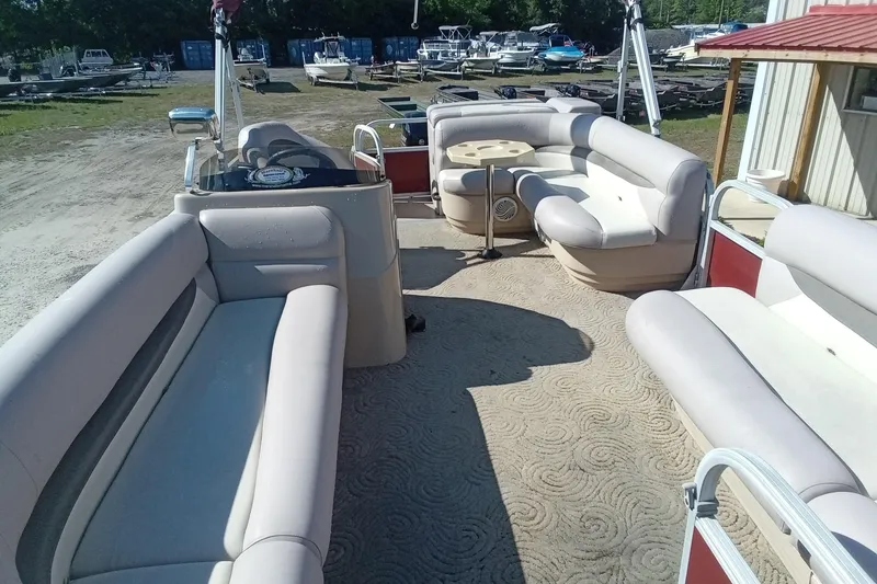 Slide: The Image of 2014 Sun Tracker Party Barge 20 DLX with spacious seating and outdoor setting. - 5