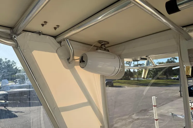 Slide: The Image of 2007 Pursuit OS 335 Offshore boat interior with mounted speaker and metal framework. - 19