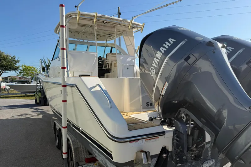 Slide: The Image of 2007 Pursuit OS 335 Offshore boat with Yamaha engines on a trailer. - 4