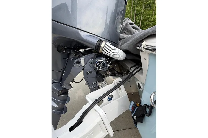 Slide: The Image of 2024 Tidewater 2110 Bay Max boat engine detail with visible components and connections. - 8